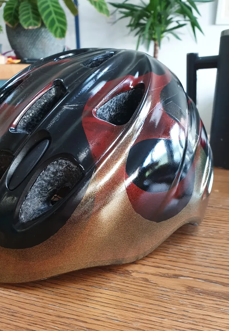 Custom bike helment airbrushed in black, red & metalic gold