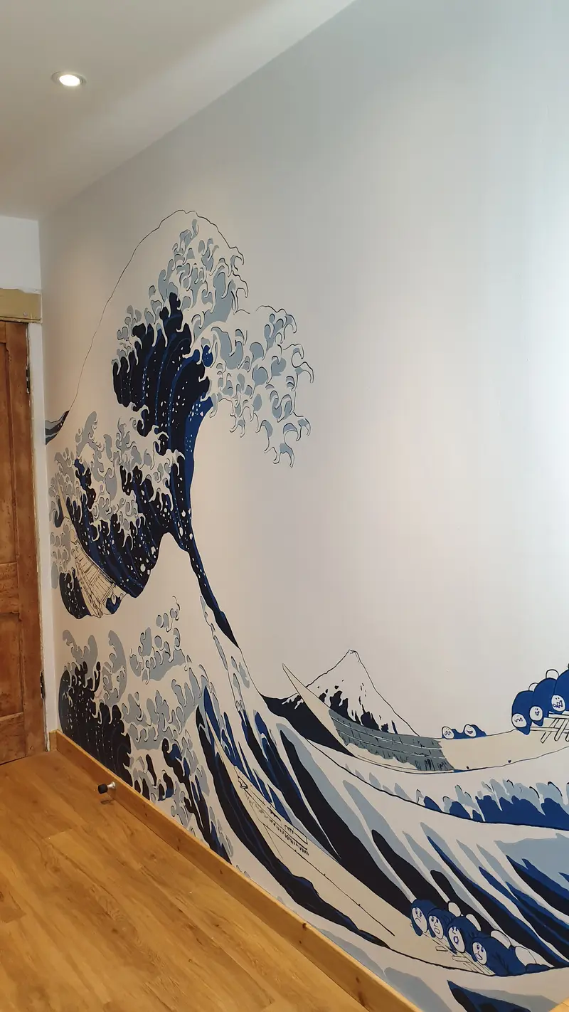 Bathroom Mural depicating large wave painted in emulsion