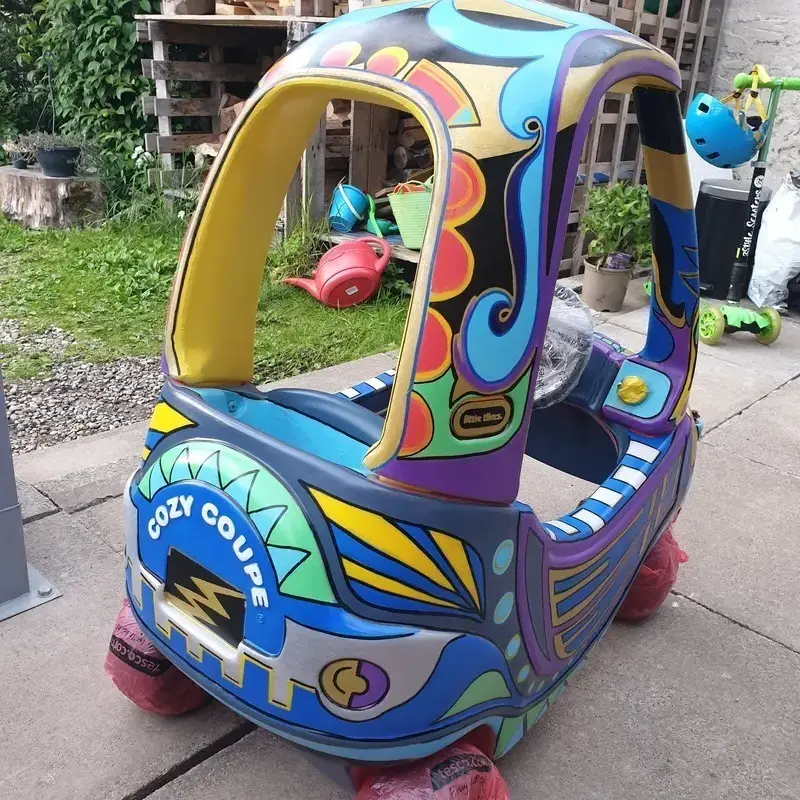 Back of Tiki Cosy Coupe toy car painted with acrylic